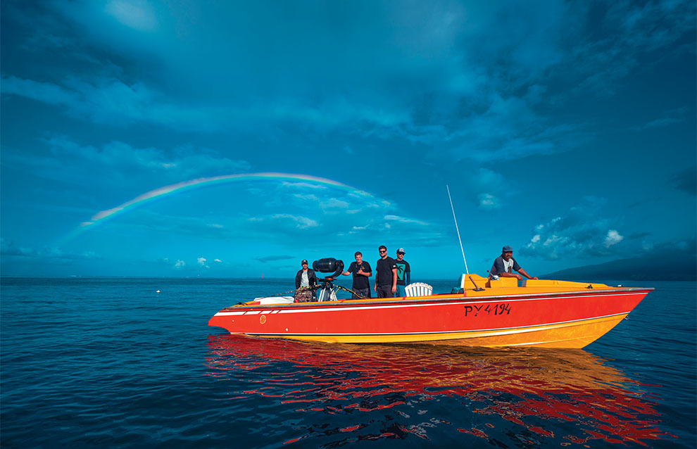 a group of people on a boat in the water