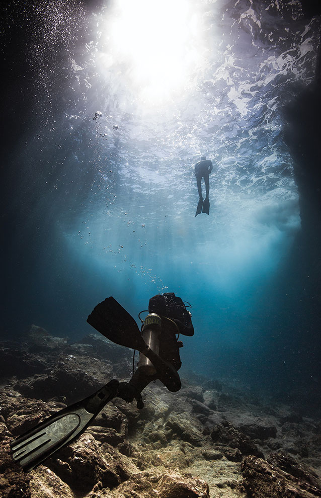 a person swimming under water