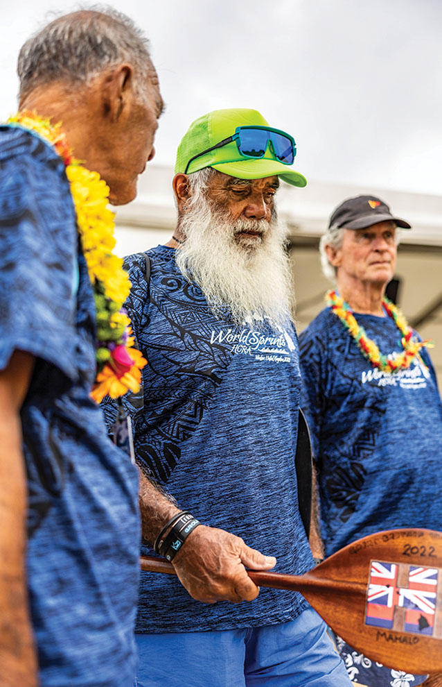 a group of men wearing blue shirts and green hat