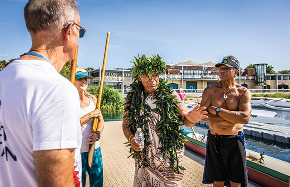 a group of people standing on a dock