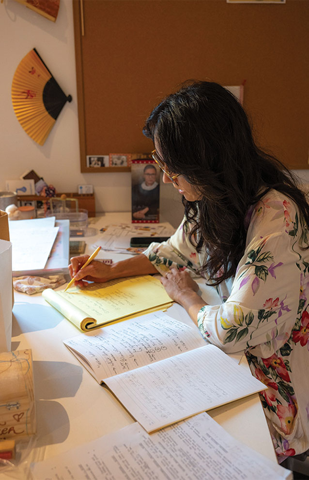 a person reading a book and taking notes