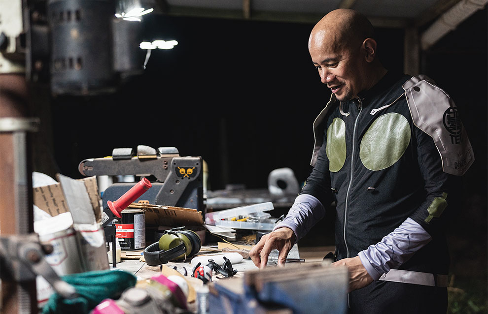 a person looking over a craft table to make costumes