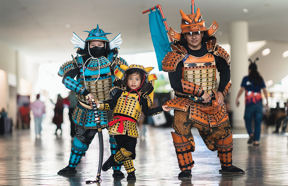 three people in costume