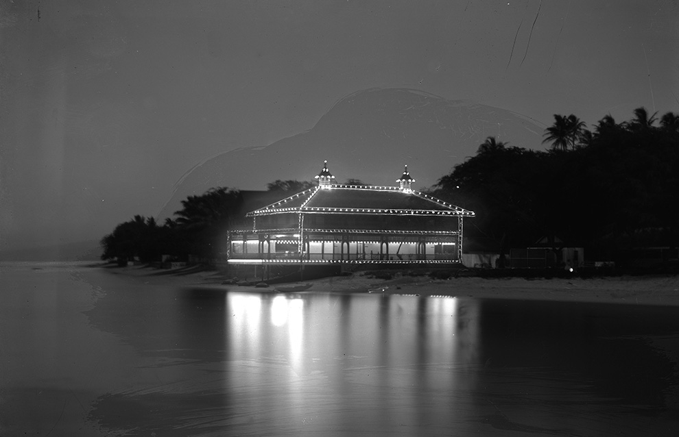 a black and white photo of an oceanside house